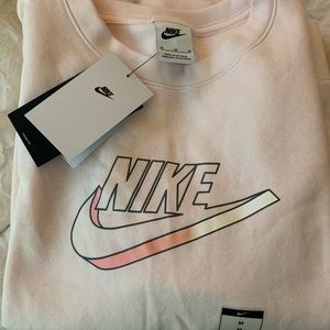 Nike light pink sweatshirt with tags.  Size medium